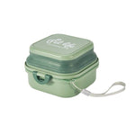 Load image into Gallery viewer, Green Dog Travel Folding Bowl in collapsed form with carrying strap, space-saving and ideal for outdoor pet feeding and hydration.