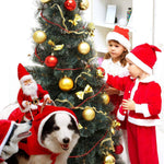 Load image into Gallery viewer, Two kids in Santa outfits decorate a Christmas tree while dogs wear Santa Claus reindeer costumes nearby