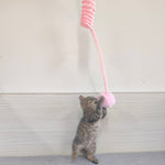 Load image into Gallery viewer, Kitten playing with pink rabbit fur ball teaser attached to a spring suction cat toy for exercise and fun