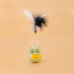Load image into Gallery viewer, Rotating feather cat toy with interactive tumbler roller, catnip-filled balls, and attached black and white feathers