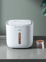Load image into Gallery viewer, White sealed pet food storage box for dogs and cats with a clear window and measuring scoop on a countertop