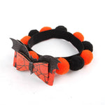 Load image into Gallery viewer, Halloween pet collar with orange and black fur balls and a bat-themed bow for dogs and cats