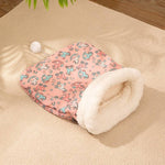 Load image into Gallery viewer, Cozy pink flannel cat sleeping bag nest with soft white fleece lining and playful animal print design on beige carpet.