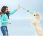 Load image into Gallery viewer, Woman playing with dog using a dog training chew ball with draw rope tug toy for teeth cleaning outdoors