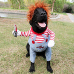 Load image into Gallery viewer, Black dog wearing a Halloween costume with red wig, striped shirt, blue overalls, and a fake knife prop for parties