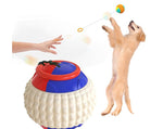 Load image into Gallery viewer, Dog playing with a blue and red chew ball toy attached to a draw rope for training and teeth cleaning