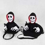 Load image into Gallery viewer, Close-up of Halloween Pet Teddy Cape Costume showing two skeleton rider designs. Soft, adjustable fit for dogs and cats.