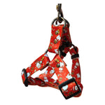 Load image into Gallery viewer, Adjustable red Christmas dog harness with snowman and holiday designs, durable polyester with metal rings and buckle closures.