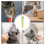 Load image into Gallery viewer, Green cat strip feeder spoon shown with cats eating wet food from it and from a bowl and feeding station.