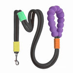 Load image into Gallery viewer, Heavy-duty black dog leash with soft purple foam handle and secure yellow and green accents for anti-slip grip and pet traction