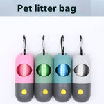 Load image into Gallery viewer, Set of four LED light pet waste bag dispensers with carabiner clips in pink, green, blue, and gray colors for dogs and cats.