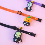 Load image into Gallery viewer, Three adjustable Halloween pet collars with cartoon skeleton, pumpkin, and skull decorations for cats and dogs on pink background