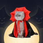 Load image into Gallery viewer, Gray cat wearing a red and black vampire cloak costume for Halloween with a full moon and bats background