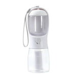 Load image into Gallery viewer, 3-in-1 portable dog water bottle with built-in feeder, waste bag dispenser, and travel bowl in white and clear plastic design