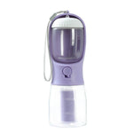 Load image into Gallery viewer, Portable 3-in-1 dog water bottle with feeder, waste bag, and bowl combo for travel and outdoor use