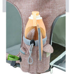 Load image into Gallery viewer, Side pocket of transparent cat backpack carrier holding a water bottle, showing brown fabric and mesh ventilation panel