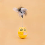 Load image into Gallery viewer, Yellow rotating cat toy with feathers and spring, designed for interactive play with catnip and a track ball inside