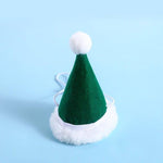 Load image into Gallery viewer, Green Santa Claus hat with white trim and pompom, festive winter accessory for small and medium pets.