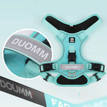 Load image into Gallery viewer, Close-up of turquoise no-pull dog harness showing reflective DUOMM strap and GPS tag holder, designed for secure pet tracking.