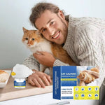 Load image into Gallery viewer, Man holding an orange and white cat next to a cat calming pheromone diffuser refill and product packaging on a table