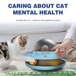 Load image into Gallery viewer, Cat and owner using the blue Flying Saucer Pet Slow Feeder, designed to support mental health and exercise through treat-based play.