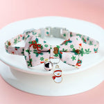 Load image into Gallery viewer, Adjustable Christmas pet collar with festive bow tie, holiday prints, jingle bell, and snowman charm for dogs and cats