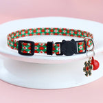 Load image into Gallery viewer, Adjustable Christmas pet collar with festive red and green pattern, black buckle, bell, and snowflake charm for dogs and cats