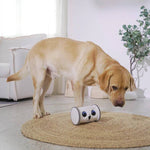 Load image into Gallery viewer, Owl Pet Robot – Interactive Toy with Camera & Treat Dispenser being observed by a curious dog on a round rug in a bright room.