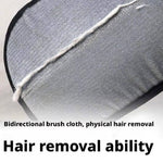 Load image into Gallery viewer, Close-up of pet hair remover glove showing bidirectional brush cloth with collected pet hair on gray fabric surface