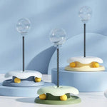 Load image into Gallery viewer, Three Interactive Cat Toy & Feeder Sets in pastel blue, green, and yellow, displayed on blue platforms for product showcase.