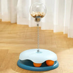 Load image into Gallery viewer, Blue Interactive Cat Toy & Feeder Set with orange turntable balls and transparent treat globe, placed on a wooden floor.