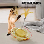 Load image into Gallery viewer, Cat playing with 360-degree non-tilting tumbler toy featuring turntable feathers and dental play balls