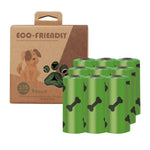 Load image into Gallery viewer, Eco-friendly green dog poop bag rolls with bone prints and recyclable cardboard packaging for easy pet waste cleanup.