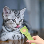 Load image into Gallery viewer, Grey tabby kitten licking reusable green cat strip feeder spoon with wet food dispenser for cats and dogs