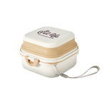 Load image into Gallery viewer, White Dog Travel Folding Bowl with tan accents and wrist strap, designed for convenient pet feeding and hydration outdoors.