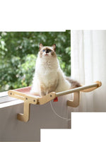 Load image into Gallery viewer, Fluffy cat sitting on a wooden window-mounted hanging bed with soft fabric, perfect for cozy resting and space-saving.