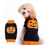 Load image into Gallery viewer, Small dog wearing black knitted Halloween sweater with orange pumpkin design and orange trim on neck and hem