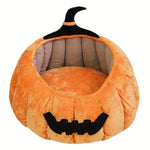 Load image into Gallery viewer, Soft plush pumpkin-shaped pet bed with warm interior and black Halloween-themed details for cats and small dogs
