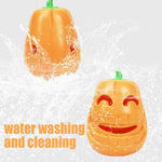 Load image into Gallery viewer, Indestructible pumpkin-shaped dog chew toy designed for aggressive chewers and puppies, shown being washed with water.