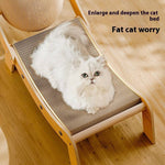 Load image into Gallery viewer, White fluffy cat lounging on a wooden recliner cat scratcher toy with deep claw board surface