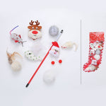 Load image into Gallery viewer, Christmas-themed cat toy set with reindeer, Santa wand, mice, feathers, and pom-poms in festive stocking packaging