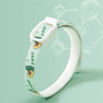Load image into Gallery viewer, Flea and tick repellent collar for dogs and cats with avocado design and secure buckle on green background.