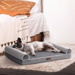 Load image into Gallery viewer, Medium-sized dog resting comfortably on a grey orthopedic egg foam dog bed with raised sofa-style edges.