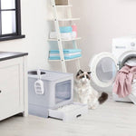 Load image into Gallery viewer, Grey enclosed cat litter box with slide-out tray and top exit placed in modern laundry room with cat nearby
