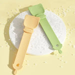 Load image into Gallery viewer, Reusable cat strip feeder spoons in green and yellow for dispensing wet food to cats and dogs.