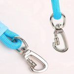 Load image into Gallery viewer, Close-up of heavy-duty blue dog leash with sturdy metal swivel clips and anti-slip soft foam handle for pet traction.