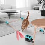 Load image into Gallery viewer, Cat playing with Adjustable Cat Treadmill Toy in a modern living room, chasing a ribbon along a triangular track setup.