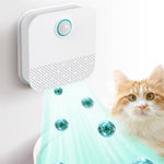 Load image into Gallery viewer, Automatic pet odor purifier mounted on wall deodorizing air near a cat and litter box area