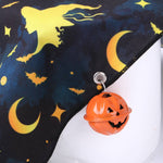 Load image into Gallery viewer, Halloween print pet bandana with bats, moons, and a pumpkin bell accessory on dark fabric triangle towel