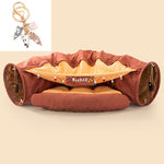 Load image into Gallery viewer, Durable collapsible cat tunnel with cushioned interior and hanging toys for interactive and washable pet playtime.
